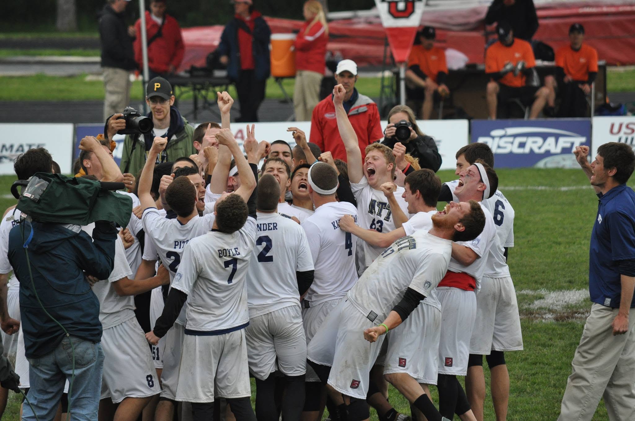 Pitt players erupting in celebration on the field after qualifying for Nationals