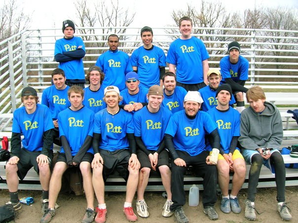 Pitt team in blue jerseys on the bleachers at Steakfest, 2006