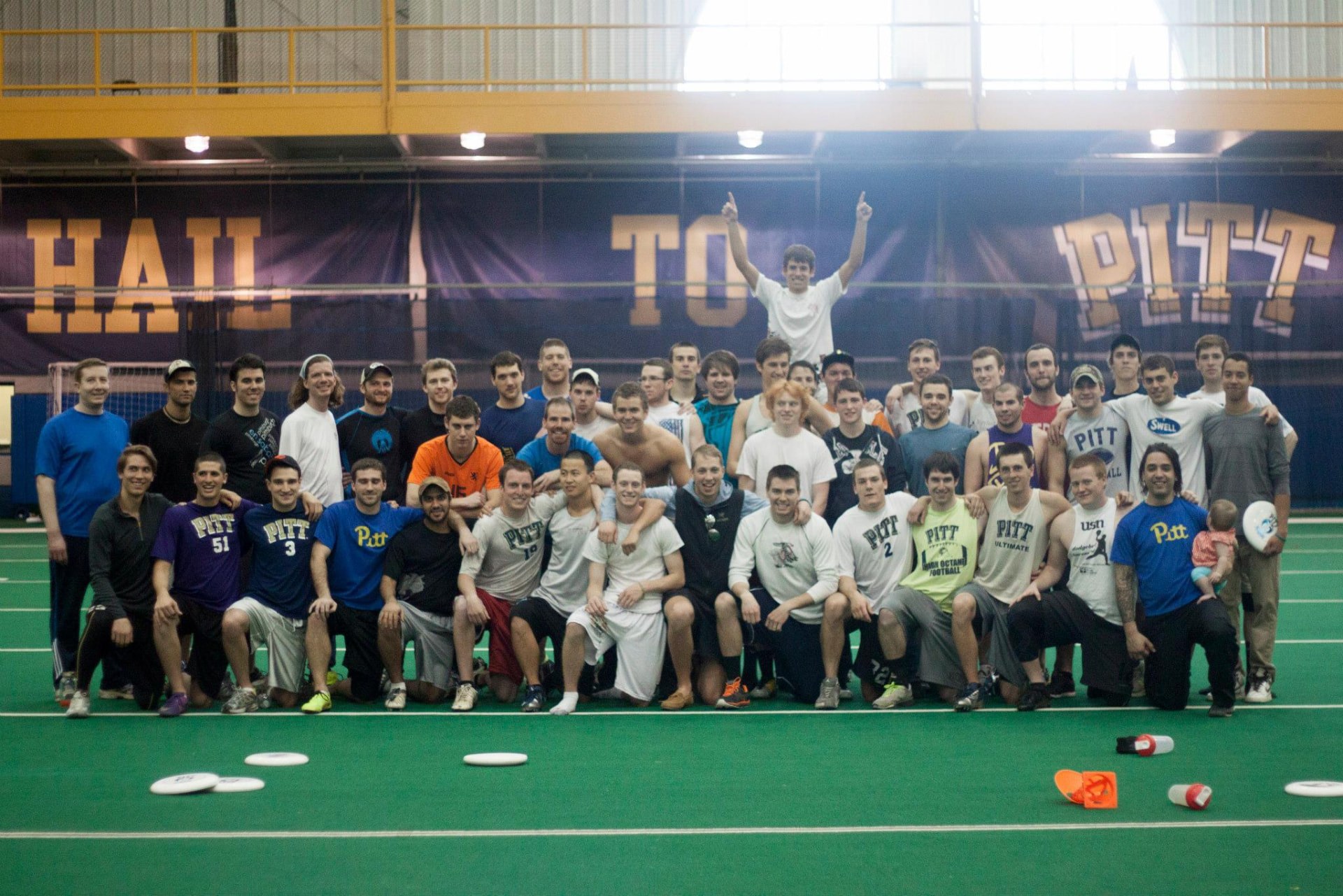 Alumni and current players together under the Hail to Pitt banner at Alumni Weekend, 2013